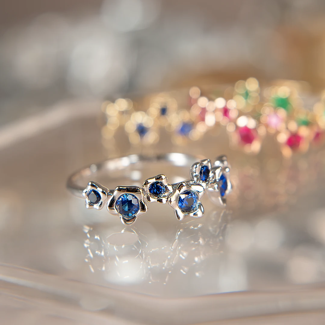 Melted gold petals blue sapphire ring